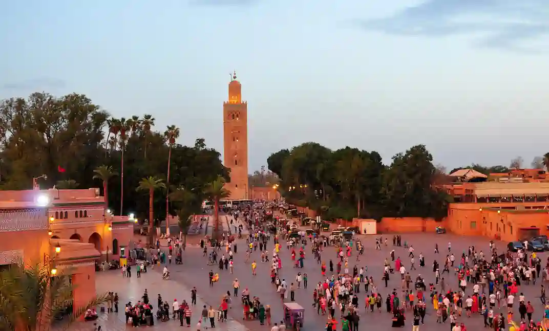 Crowds gathered in Jemaa el-Fnaa square with the Koutoubia Mosque