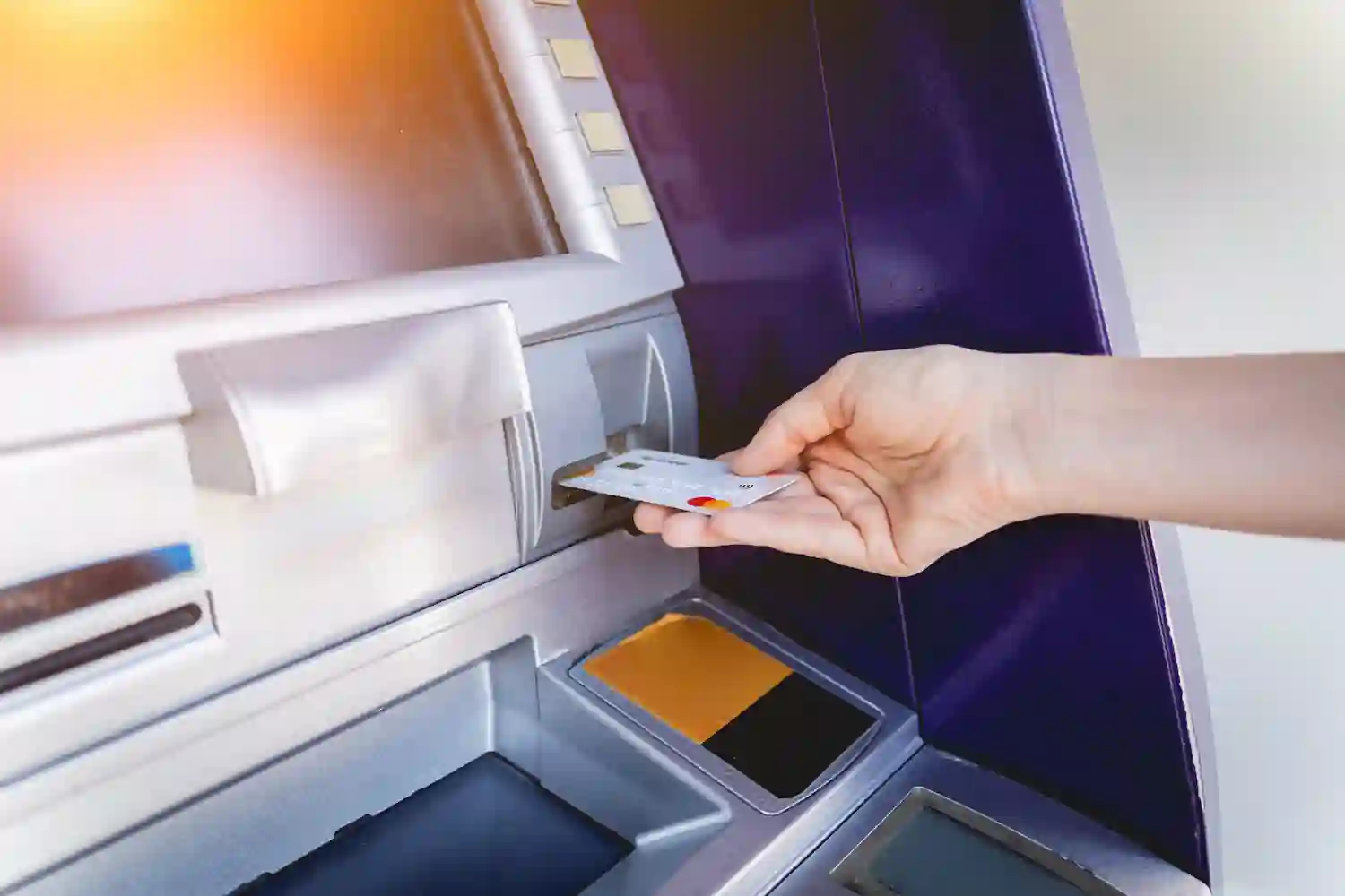 Person using ATM machine